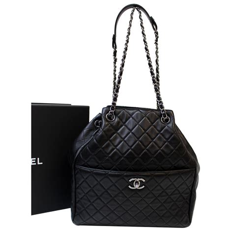 chanel black quilted bucket bag|Chanel quilted reissue shoulder bag.